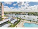 Poolside view showing boat docks and neighborhood overlooking a peaceful waterfront community at 31 Island Way # 502, Clearwater Beach, FL 33767