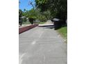 Peaceful street view with well-kept grounds and mature foliage at 4350 2Nd S Ave, St Petersburg, FL 33711