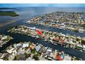 Expansive aerial view of a waterfront community with a home situated on a canal at 5008 Glenn Dr, New Port Richey, FL 34652