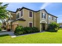 Beautiful two-story home with a well-manicured lawn and lush landscaping, creating a welcoming curb appeal at 11519 Crowned Sparrow Ln, Tampa, FL 33626