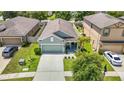 Aerial view of a home highlighting its layout, landscaping, and neighborhood at 13806 Reindeer Cir, Hudson, FL 34669