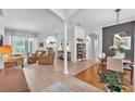Spacious living room with tile floors, neutral decor, and abundant natural light at 15206 Merlinpark Pl, Lithia, FL 33547