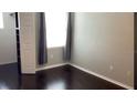 Cozy bedroom featuring hardwood floors, ample natural light, and a neutral color palette at 1910 E Palm Ave # 11322, Tampa, FL 33605