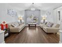 Bright living room with hardwood floors and neutral decor at 3718 Beneraid St, Land O Lakes, FL 34638