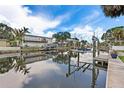 Scenic waterfront property featuring boat lifts, docks and a charming two story house at 5285 Dover Ne St, St Petersburg, FL 33703