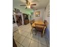 Cozy dining area with tile flooring, wooden table set, and vintage hutch, perfect for Gathering meals at 6326 38Th N Ave, St Petersburg, FL 33710