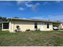 Charming single-story home with a well-maintained front yard and a covered parking area at 6383 Biscayne, North Port, FL 34287