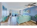 Inviting living room with comfortable seating, stylish decor, and a sliding glass door to the balcony at 8211 Brent St # 815, Port Richey, FL 34668