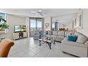 Inviting living room with neutral tones, tile flooring and beautiful views at 1540 Gulf Blvd # 2107, Clearwater Beach, FL 33767