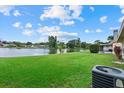 Expansive backyard overlooking a tranquil lake, perfect for outdoor enjoyment at 1741 Elk Spring Dr, Brandon, FL 33511