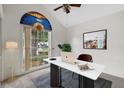 Bright office space with vaulted ceilings, a fan, and a distinctive arched window at 1741 Elk Spring Dr, Brandon, FL 33511