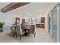 Modern dining room and kitchen featuring stainless steel appliances and stylish two-tone cabinetry at 4604 W Euclid Ave, Tampa, FL 33629
