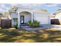 Charming single-story home featuring a well-manicured lawn and a two-car garage with a brick-paved driveway at 5528 40Th N St, St Petersburg, FL 33714