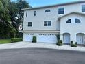 Well-maintained two-story home featuring a multi-car garage and inviting front entrances at 8158 Eagles Park N Dr, St Petersburg, FL 33709