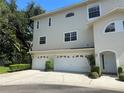 Well-maintained two-story home featuring a multi-car garage and inviting front entrances at 8158 Eagles Park N Dr, St Petersburg, FL 33709