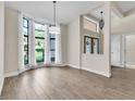 An open-concept living area with a bay window boasts great natural light and space for entertaining at 910 Kingscote Ct, Safety Harbor, FL 34695
