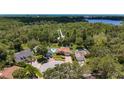 Aerial view of a single Gathering home nestled in a lush green environment with a private pool at 11362 Heritage Way, Largo, FL 33778