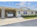 Charming one-story villa featuring a covered carport, well-maintained landscaping, and a welcoming entrance at 12400 Park Blvd # 519, Seminole, FL 33772