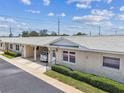 Charming one-story villa featuring a covered carport, well-maintained landscaping, and a welcoming entrance at 12400 Park Blvd # 519, Seminole, FL 33772