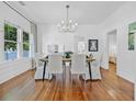 Elegant dining room with modern chandelier and natural light at 1415 7Th N Ave, St Petersburg, FL 33705