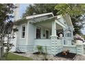 This charming home features light blue siding, stone accents and inviting front porch at 1415 7Th N Ave, St Petersburg, FL 33705