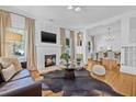 Bright living room with fireplace, hardwood floors, and elegant furnishings at 1415 7Th N Ave, St Petersburg, FL 33705
