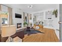 Bright living room with fireplace, hardwood floors, and elegant furnishings at 1415 7Th N Ave, St Petersburg, FL 33705