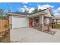 Charming home featuring a single car garage, bright red door and an easy to maintain front yard at 1717 Preston S St, St Petersburg, FL 33712