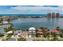 An aerial view of the home nestled on the water with ocean views at 17715 Wall Cir, Redington Shores, FL 33708