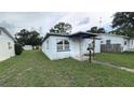 View of a single story home featuring a covered porch and small front yard at 2410 38Th N Ave, St Petersburg, FL 33713