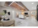 Spacious living room with unique ceiling, comfortable seating, and abundant natural light at 3197 Walnut Ne St, St Petersburg, FL 33704