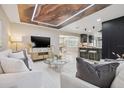 Inviting living room featuring a modern ceiling design, bar seating, and dining area at 3197 Walnut Ne St, St Petersburg, FL 33704