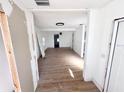 Open living room featuring new flooring and freshly painted white walls, ready for personalization at 4701 17Th S Ave, St Petersburg, FL 33711