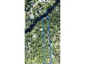 An aerial view shows the beautiful property outlined in blue, surrounded by trees and a river at 6924 Valrie Ln, Riverview, FL 33569