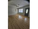 Spacious living room featuring wood floors and a decorative front door at 7001 60Th N St, Pinellas Park, FL 33781