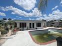 Backyard showcasing the private pool area, perfect for outdoor enjoyment in this cozy single Gathering home in a great location at 1008 Sago Palm Way, Apollo Beach, FL 33572