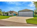 Spacious driveway leads to a home with an airplane hangar perfect for aviation enthusiasts at 11908 Pilot Country Dr, Spring Hill, FL 34610