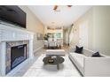 Bright living space featuring a fireplace, contemporary furniture, and an open floor plan at 1241 Redondo Way, Wesley Chapel, FL 33543