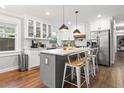 Stylish kitchen with island, stainless steel appliances, and white cabinetry at 403 E North St, Tampa, FL 33604