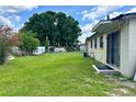 Spacious fenced backyard with mature trees offering ample space for outdoor activities at 5016 S 86Th St, Tampa, FL 33619