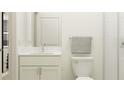 Bright bathroom with marble countertop vanity, toilet and shower at 6830 E 115Th St, Palmetto, FL 34221