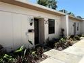 Well-maintained home exterior with landscaped yard leading to the inviting front entrance at 1605 Mission Hills Blvd # D5, Clearwater, FL 33759