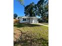 Charming single-story home with a well-maintained lawn and a convenient attached garage and front yard at 1782 Michigan Ne Ave, St Petersburg, FL 33703