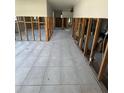 Spacious living room featuring tile flooring and exposed framing, ready for customization at 1782 Michigan Ne Ave, St Petersburg, FL 33703