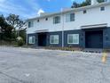 A two-story townhome building with parking, showcasing the exterior design and multiple units at 1935 Oxnard Ct, Tampa, FL 33612