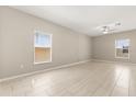 Spacious living room with neutral walls, recessed lighting, ceiling fan, and tile flooring throughout at 22359 Storybook Cabin Way, Land O Lakes, FL 34637