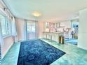 Open-concept space blending living area and kitchen with lots of natural light and stylish decor at 2707 56Th S St, Gulfport, FL 33707