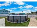 Backyard with outdoor above ground pool and nice view to the canal at 3260 Gulfview Dr, Hernando Beach, FL 34607