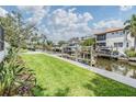 Beautiful backyard featuring a canal, dock, and lush landscaping, great for waterfront living at 650 Geneva Pl, Tampa, FL 33606