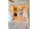 Spacious living room with outdated flooring and plenty of natural light at 9510 Mark Twain Ln, Port Richey, FL 34668